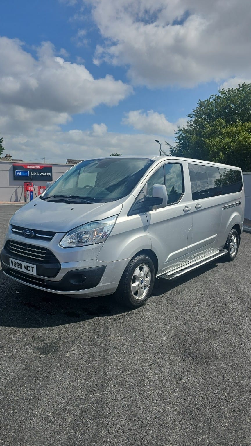 MC Transfers minivan, front three-quarter view